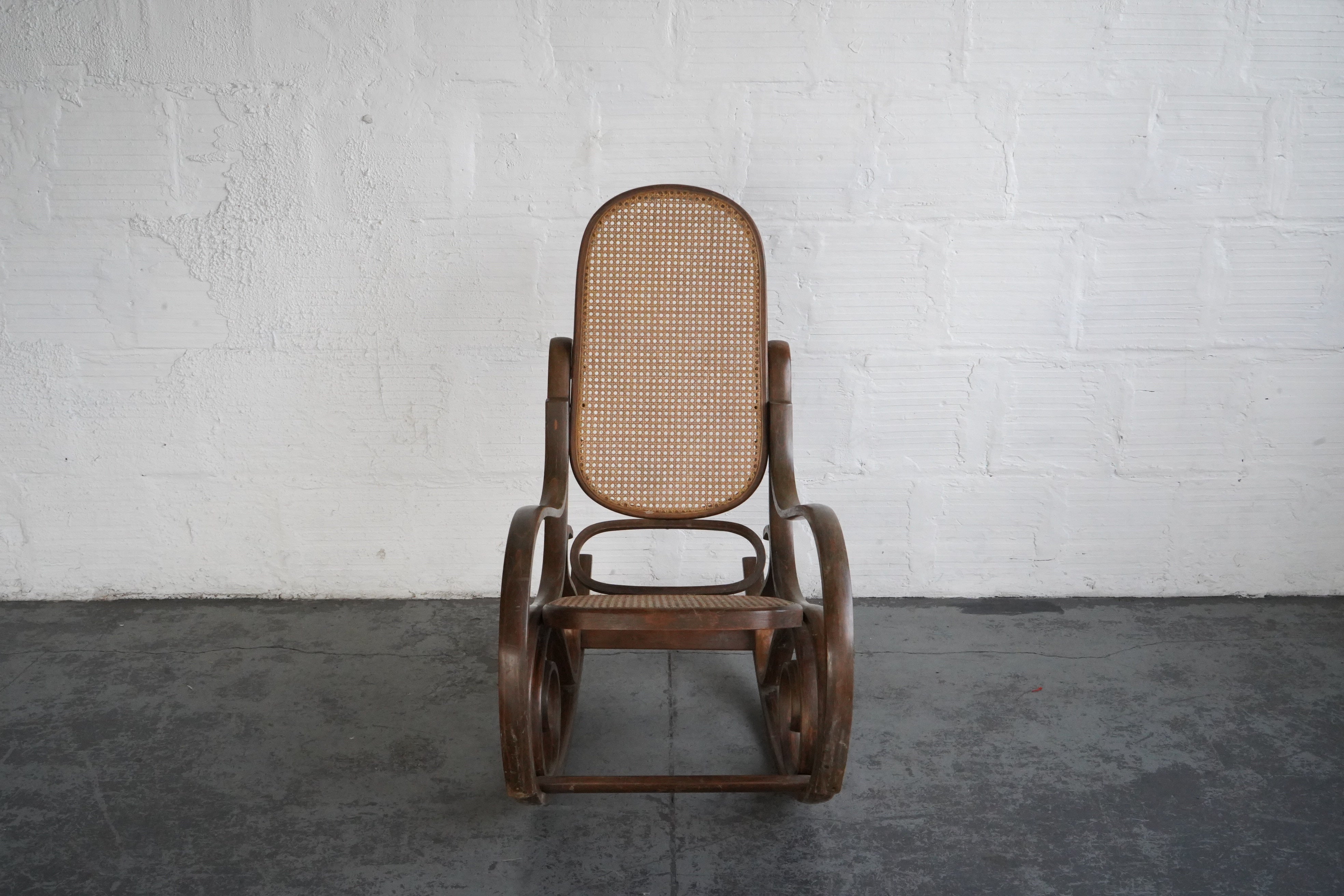 Antique cane rocking chair value sales